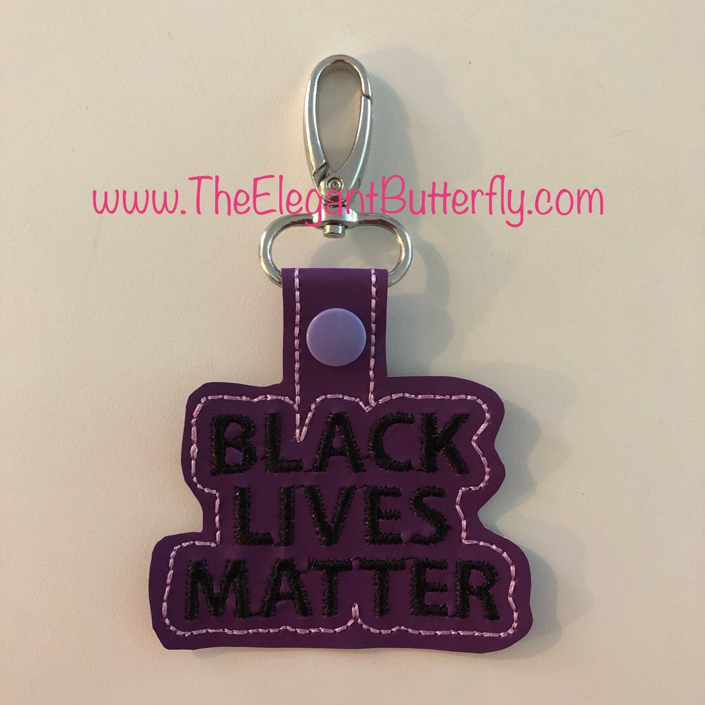 In the Hoop Snap tab Black Lives Matter BOLD FONT Embroidery File- Comes with 4x4 and also 5x7 to make 2 snap tabs at one time.